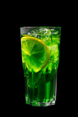 Summer green drink with lemon, lime and mint, ice on isolated black background. Direct perspective, cool, refreshing
