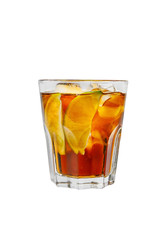 A single-colored transparent cocktail, refreshing in a low glass with radiant ice cubes with taste of berries, cola and slice, lime quartet. Side view Isolated white background