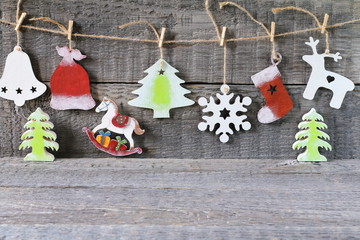 Bright Christmas and New Year decorations made of wood on the wooden background.