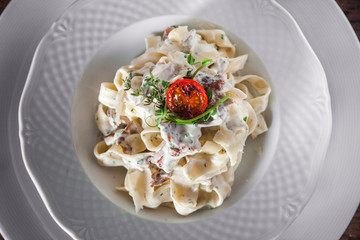 Pasta with mushrooms in creamy sauce