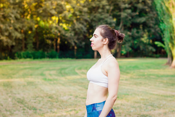 Slim young woman  looking into the distance.Sport concept