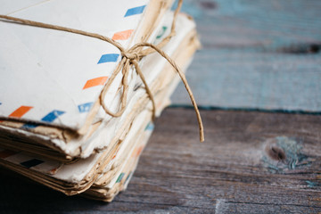 Stack of vintage letters on wooden table