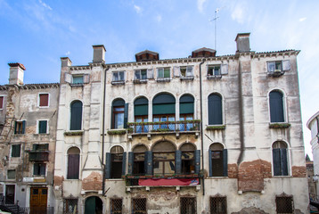 Naklejka premium Old palace on the small canal of Venice, Italy