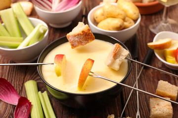 cheese fondue with fruit and vegetable