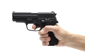 Gun, pistol in hand isolated on white