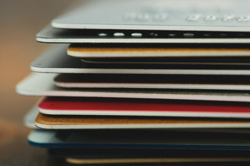 Stack of multicolored credit cards close-up 