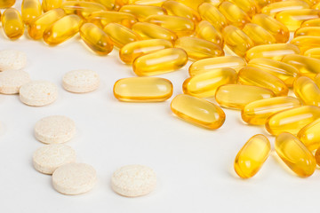 Tablets, pills or vitamins. Fish oil in capsules. Baby and female vitamins.