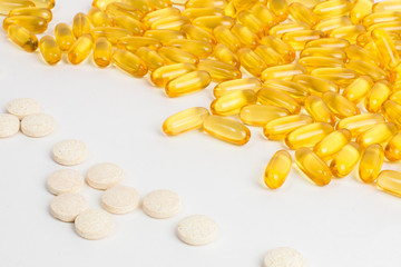 Tablets, pills or vitamins. Fish oil in capsules. Baby and female vitamins.