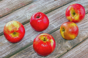 Red apple in wooden background