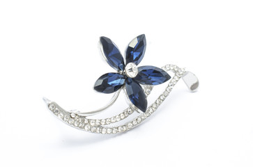 Silver flower brooch isolated on white