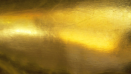 Shiny yellow leaf gold foil texture background