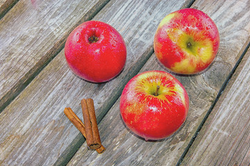 Red apple in wooden background