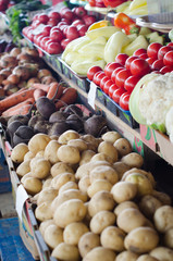 big choice of fresh fruits and vegetables on market counter