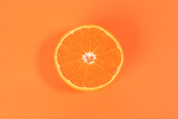 Mandarin Orange Fruit slice half on orange background
