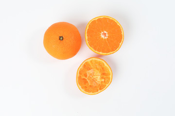 Fototapeta na wymiar Mandarin Orange Fruit slice half juiced extracted on white background