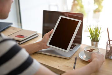 Fototapeta na wymiar Businesswoman using tablet on his workspace