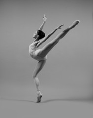 Ballerina in pointe shoes and beige body