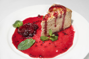 piece of pie with strawberry jam, decorated with mint leaves. sweet dessert. shortcake with strawberries.