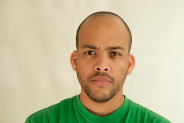 Obraz premium Man in green t-shirt face portrait