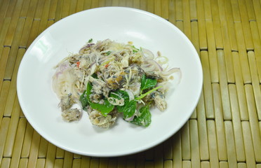 spicy minced mackerel with herb Thai salad on dish