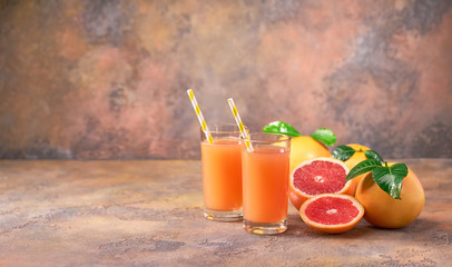 Two glass of  fresh grapefruit juice on  a abstract  background with copy space