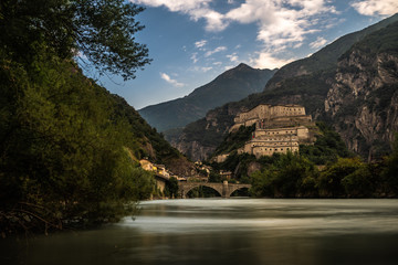 aosta old castle with river in north italy cloudy sky forte di bard