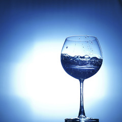 aqua water champagne glass on white blue background