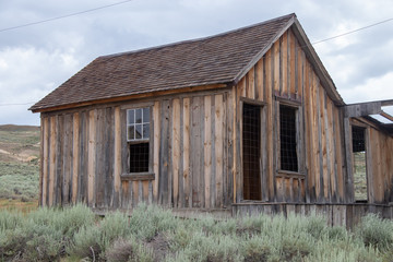 Fototapeta na wymiar An Old House in the Ghost Town of Bodie Located in California's Eastern Sierra Mountains