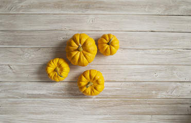 pumpkins on wooden board