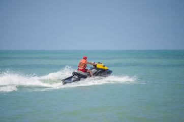 Fototapeta na wymiar lifeguard on a water scooter