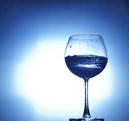 aqua water champagne glass on white blue background
