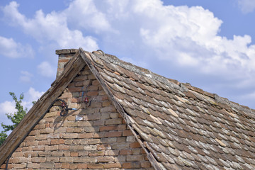 Fototapeta na wymiar Old tile on the roof