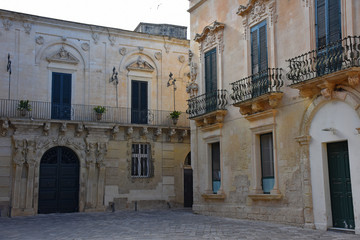 Fototapeta na wymiar Italy, Lecce, ancient buildings and streets of the old town, views and details, doors, windows and various architectures.