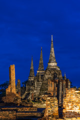 Fototapeta premium Wat Phra Si Sanphet temple at twilight blue hour with light up, Ayutthaya