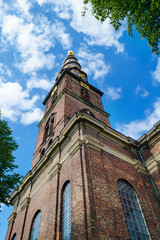 Obraz premium Beautiful Church of Our Savior. Copenhagen, Denmark, against the blue sky. Bottom view. Architecture.