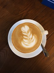 Delicious cappuccino coffee in a white mug