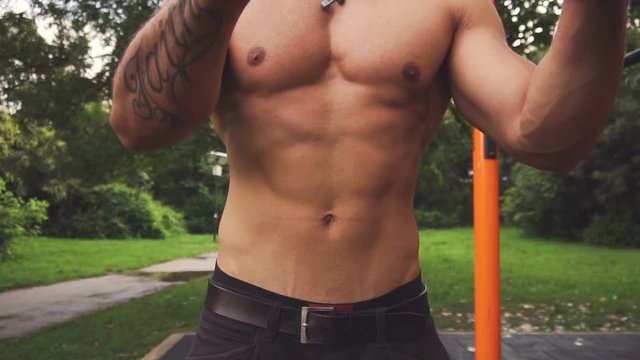 Abs and chest of bodybuilder -Close up Slow motion