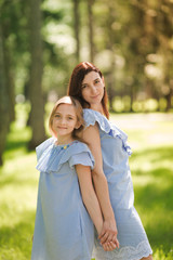 Fototapeta premium Happy mother and daughter in the park