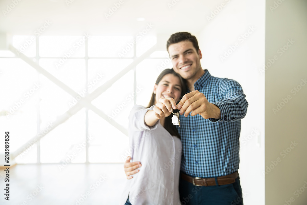 Wall mural loving partners showing keys of new house