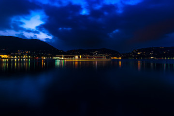 Fototapeta na wymiar Como Lake, Lombardia, Italy. Picture made during last hours of light on this beautfiul place, one of the nicest in Italy. Como lake at night, long exposure.