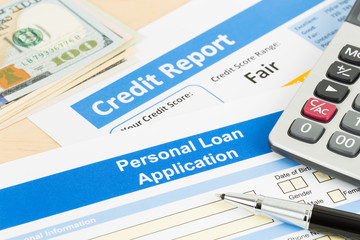 Personal loan application form fair credit score with calculator, dollar money, and pen