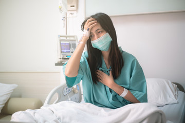 young woman patient sit on bed in hospital