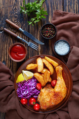 fried potato wedges ,chicken leg, coleslaw