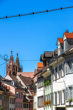 View on the historic town of Freiburg im Breisgau, Germany with the Freiburg Minster cathedral on a sunny day.