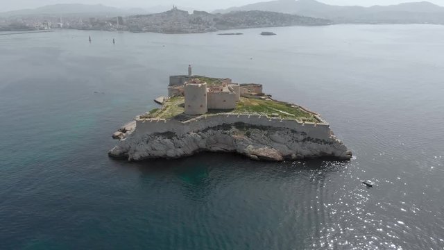 Aerial of Ch&acirc;teau d'If, famous island of Count of Monte Cristo in southeastern France.  Flying over French island in the Frioul archipelago in Mediterranean. Historical fortress and prison in France.