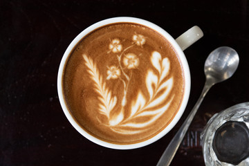 Top view latte art coffee cup.