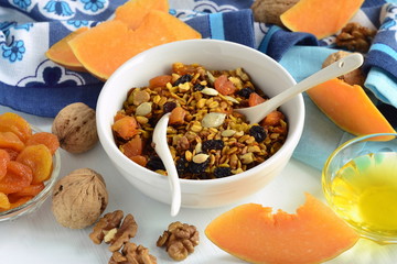 Pumpkin homemade granola with walnuts and dried fruits