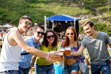 Friends enjoy in Rock concert on the field
