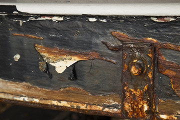 Rusted metal work on a boat hull