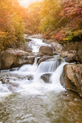 Waterfall in national park during autumn